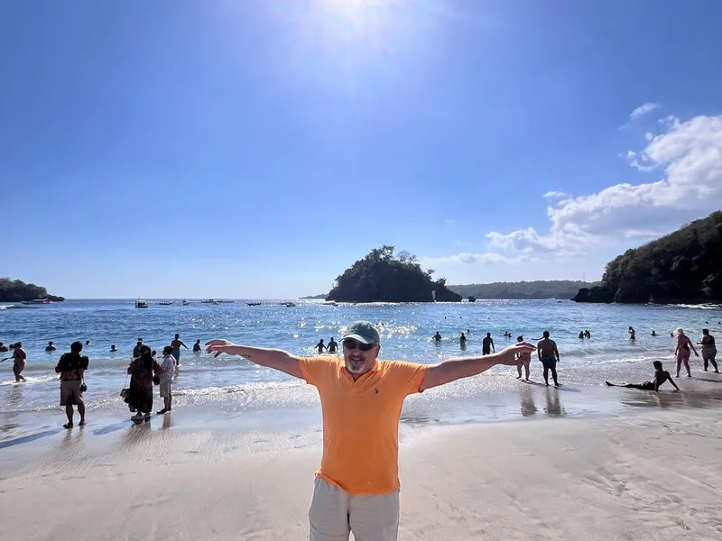 Guest on the white sand of Crystal Bay beach, Nusa Penida
