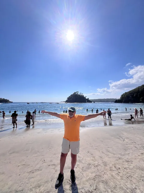 Guest enjoying the white sand of Crystal Bay beach